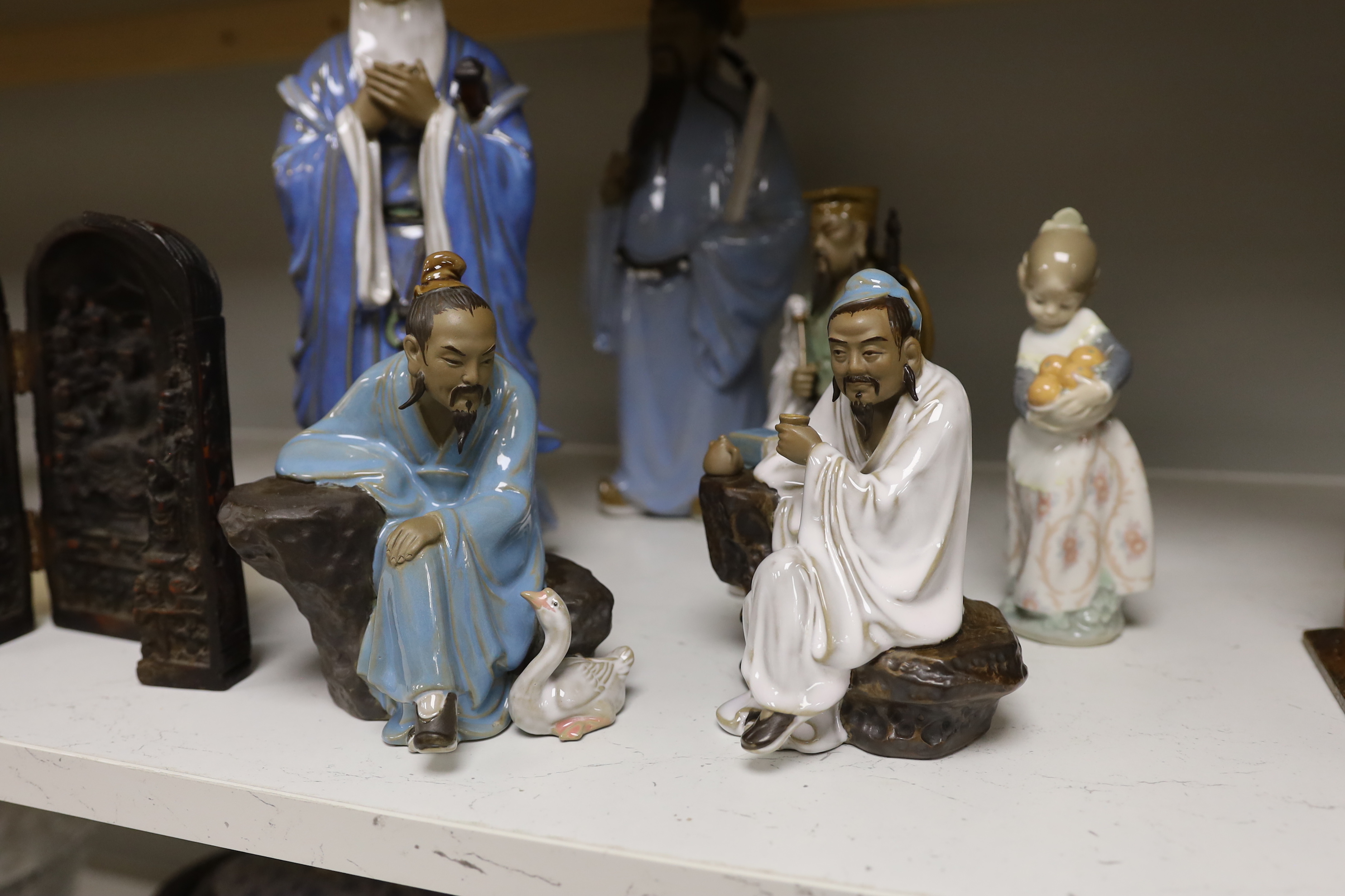 A group of Chinese Shiwan stoneware figures, a composition triptych shrine and a Lladro figure, tallest 33cm high